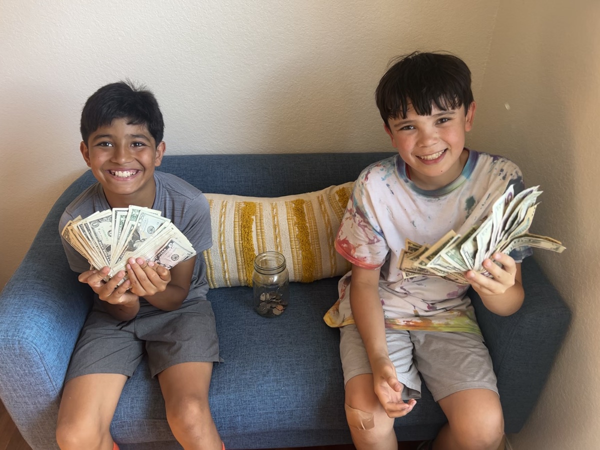 Beaming with pride from their lemonade stand earnings.
